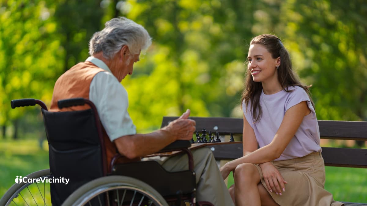 Older woman applying online for a My Aged Care assessment at her kitchen table