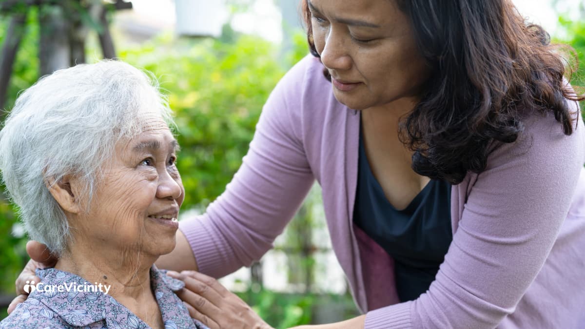 Older woman reviewing her in-home aged care funding plan with a support worker