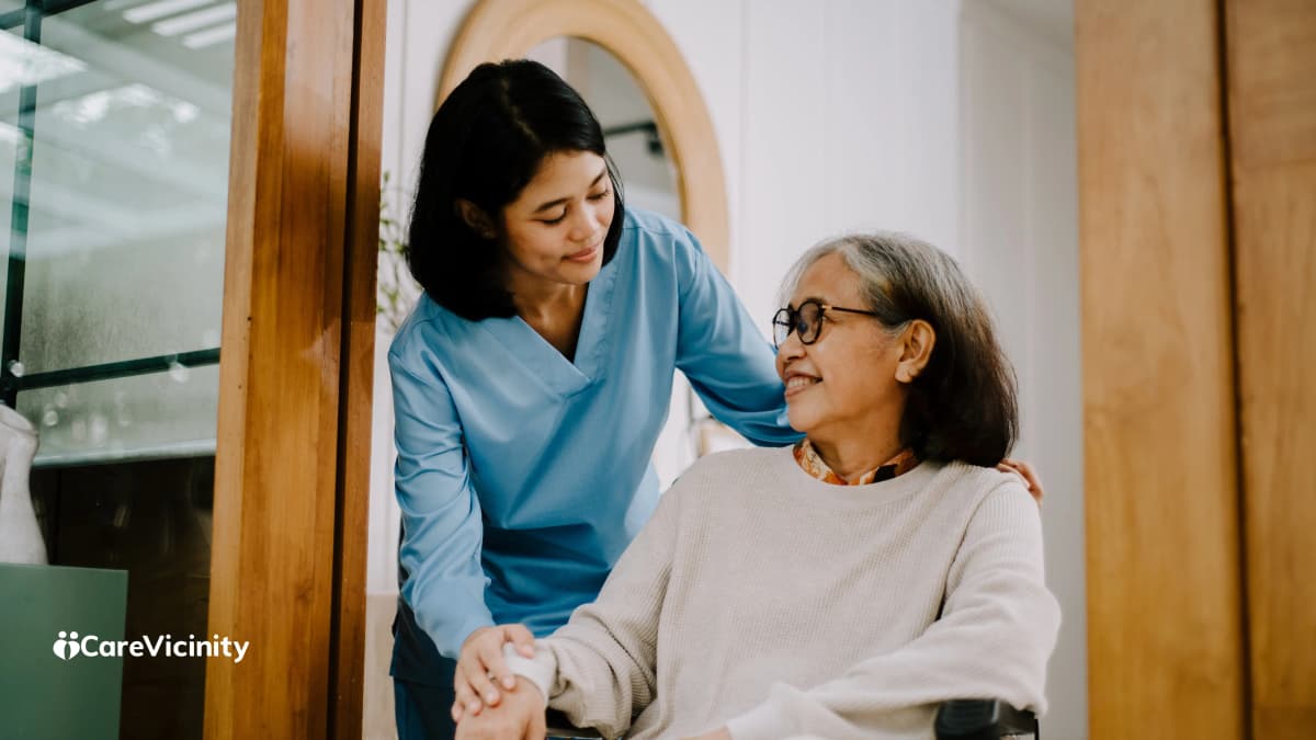 Independent support worker helping an older client in their home