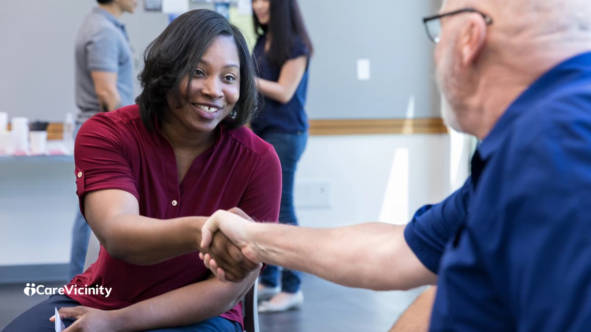 Support worker reviewing screening and registration documents before starting work