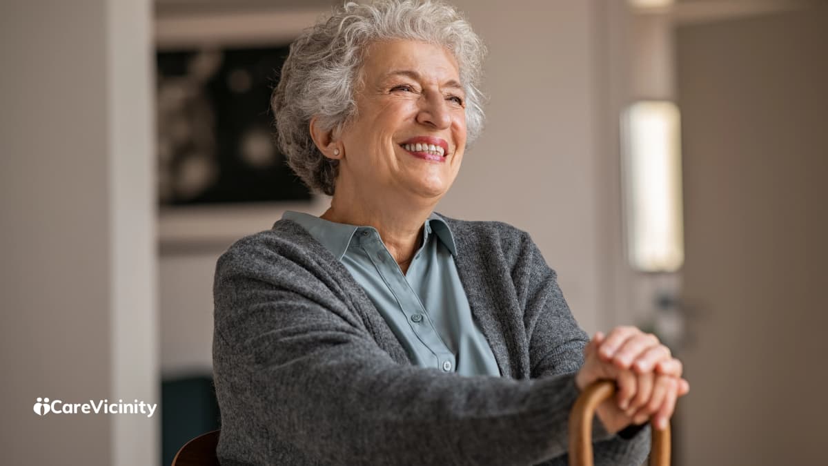 Care coordinator reviewing client schedules and outstanding actions at her desk