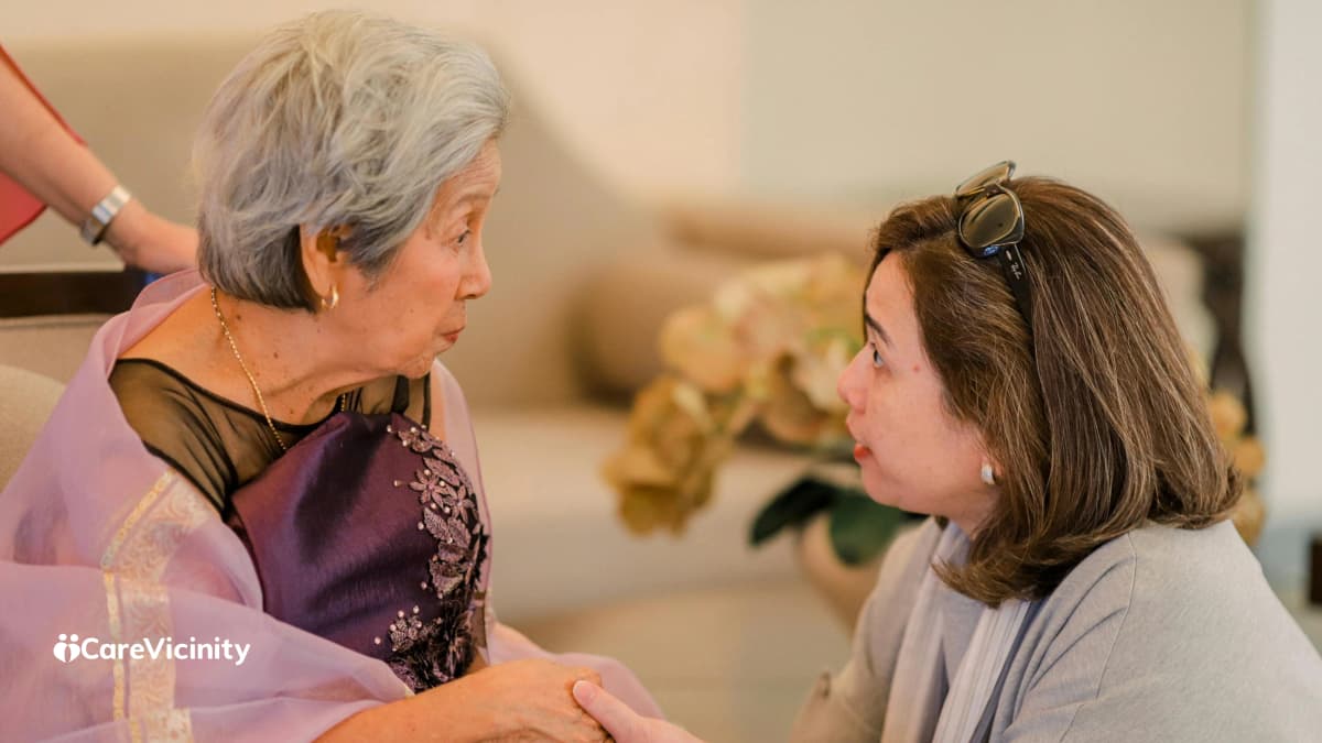Family member checking in with an older relative at home